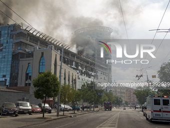 The roof of an unfinished building is catching fire near the Lukianivska metro station as a result of a Russian missile attack in Kyiv, Ukra...