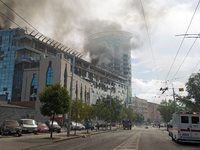 The roof of an unfinished building is catching fire near the Lukianivska metro station as a result of a Russian missile attack in Kyiv, Ukra...