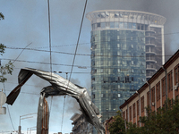 A piece of debris is hanging on the overhead line used by trolleybuses near the Lukianivska metro station during a Russian missile attack in...