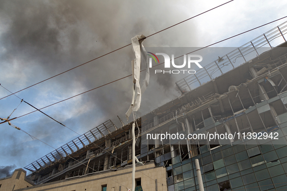 The roof of an unfinished building is catching fire near the Lukianivska metro station as a result of a Russian missile attack in Kyiv, Ukra...