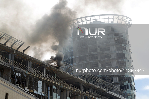 The roof of an unfinished building is catching fire near the Lukianivska metro station as a result of a Russian missile attack in Kyiv, Ukra...