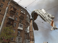 A piece of debris is hanging on the overhead line used by trolleybuses near the Lukianivska metro station during a Russian missile attack in...