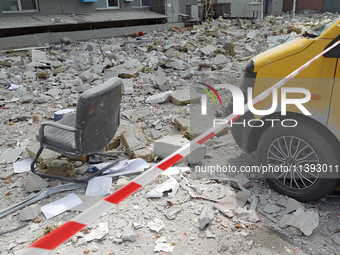 An office chair is among the rubble covering the ground at a business building in the Solomianskyi district damaged by a Russian missile str...