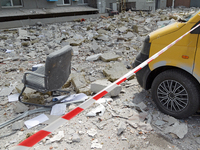 An office chair is among the rubble covering the ground at a business building in the Solomianskyi district damaged by a Russian missile str...