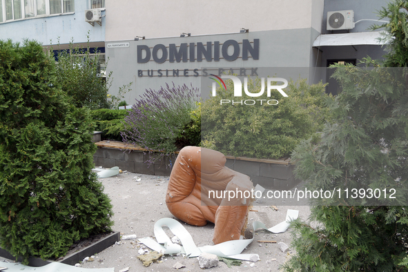 An armchair is lying outside an office building in the Solomianskyi district during a response effort to a Russian missile strike in Kyiv, U...