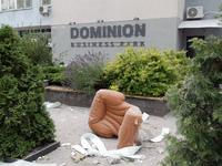 An armchair is lying outside an office building in the Solomianskyi district during a response effort to a Russian missile strike in Kyiv, U...