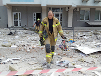 Rescue workers are at a building in the Solomianskyi district damaged by a Russian missile strike in Kyiv, Ukraine, on July 8, 2024. NO USE...