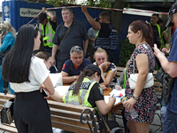 A police officer is collecting personal information from people injured during a Russian missile strike in the Solomianskyi district in Kyiv...