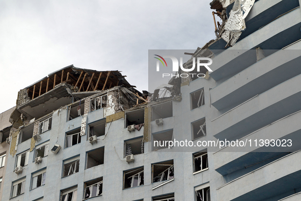 The top floors of an office building at 40 Ushynskoho Street in the Solomianskyi district are being destroyed by a Russian missile strike in...