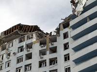 The top floors of an office building at 40 Ushynskoho Street in the Solomianskyi district are being destroyed by a Russian missile strike in...