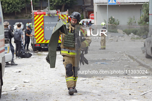 A rescue worker is responding to a Russian missile strike in the Solomianskyi district in Kyiv, Ukraine, on July 8, 2024. 