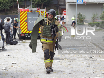 A rescue worker is responding to a Russian missile strike in the Solomianskyi district in Kyiv, Ukraine, on July 8, 2024. (