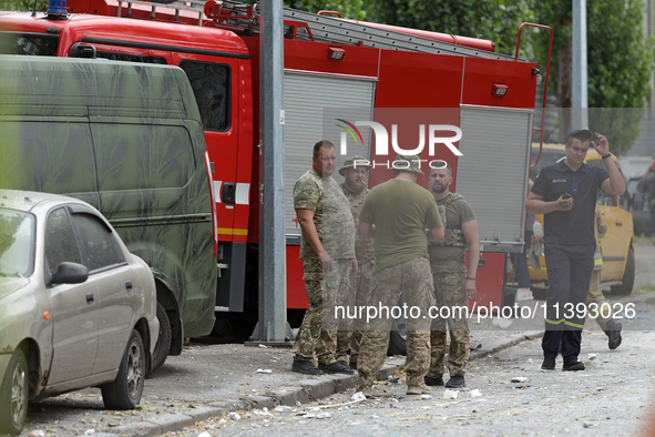 Servicemen and rescue workers are responding to a Russian missile strike in the Solomianskyi district in Kyiv, Ukraine, on July 8, 2024. NO...