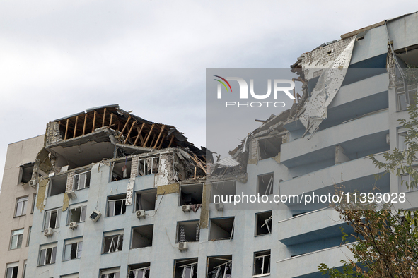 The top floors of an office building at 40 Ushynskoho Street in the Solomianskyi district are being destroyed by a Russian missile strike in...