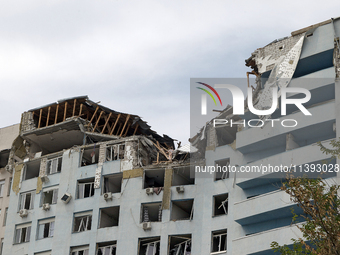 The top floors of an office building at 40 Ushynskoho Street in the Solomianskyi district are being destroyed by a Russian missile strike in...