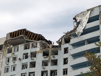 The top floors of an office building at 40 Ushynskoho Street in the Solomianskyi district are being destroyed by a Russian missile strike in...