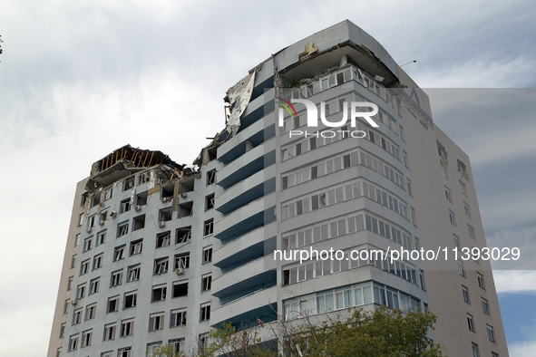 The top floors of an office building at 40 Ushynskoho Street in the Solomianskyi district are being destroyed by a Russian missile strike in...