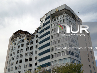 The top floors of an office building at 40 Ushynskoho Street in the Solomianskyi district are being destroyed by a Russian missile strike in...