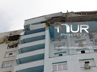 The top floors of an office building at 40 Ushynskoho Street in the Solomianskyi district are being destroyed by a Russian missile strike in...