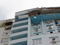 The top floors of an office building at 40 Ushynskoho Street in the Solomianskyi district are being destroyed by a Russian missile strike in...