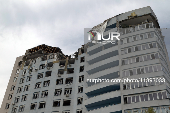 The top floors of an office building at 40 Ushynskoho Street in the Solomianskyi district are being destroyed by a Russian missile strike in...