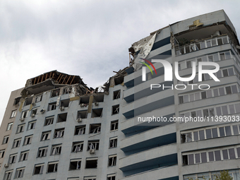 The top floors of an office building at 40 Ushynskoho Street in the Solomianskyi district are being destroyed by a Russian missile strike in...