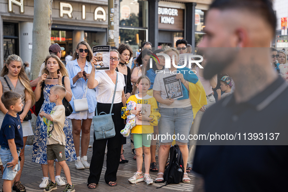 Ukrainian community protest against the Russian shelling of Ohmatdyt Children's Hospital in Kyiv, Ukraine, in Barcelona, Spain, on July 8, 2...