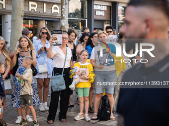 Ukrainian community protest against the Russian shelling of Ohmatdyt Children's Hospital in Kyiv, Ukraine, in Barcelona, Spain, on July 8, 2...