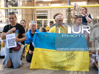 Ukrainian community protest against the Russian shelling of Ohmatdyt Children's Hospital in Kyiv, Ukraine, in Barcelona, Spain, on July 8, 2...