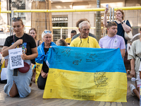 Ukrainian community protest against the Russian shelling of Ohmatdyt Children's Hospital in Kyiv, Ukraine, in Barcelona, Spain, on July 8, 2...