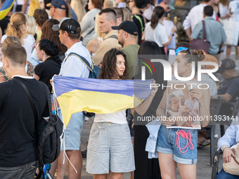 Ukrainian community protest against the Russian shelling of Ohmatdyt Children's Hospital in Kyiv, Ukraine, in Barcelona, Spain, on July 8, 2...