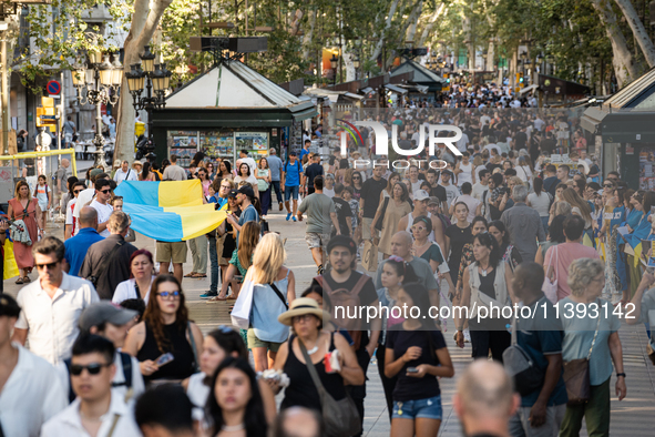 Ukrainian community protest against the Russian shelling of Ohmatdyt Children's Hospital in Kyiv, Ukraine, in Barcelona, Spain, on July 8, 2...