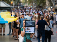 Ukrainian community protest against the Russian shelling of Ohmatdyt Children's Hospital in Kyiv, Ukraine, in Barcelona, Spain, on July 8, 2...