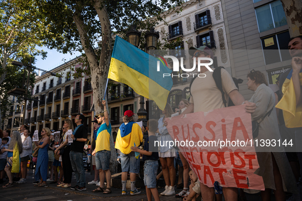 Ukrainian community protest against the Russian shelling of Ohmatdyt Children's Hospital in Kyiv, Ukraine, in Barcelona, Spain, on July 8, 2...