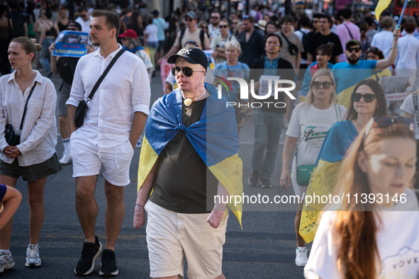 Ukrainian community protest against the Russian shelling of Ohmatdyt Children's Hospital in Kyiv, Ukraine, in Barcelona, Spain, on July 8, 2...