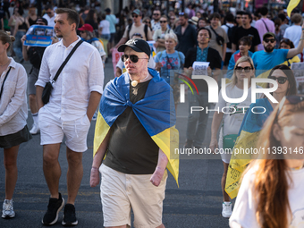 Ukrainian community protest against the Russian shelling of Ohmatdyt Children's Hospital in Kyiv, Ukraine, in Barcelona, Spain, on July 8, 2...