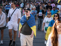 Ukrainian community protest against the Russian shelling of Ohmatdyt Children's Hospital in Kyiv, Ukraine, in Barcelona, Spain, on July 8, 2...