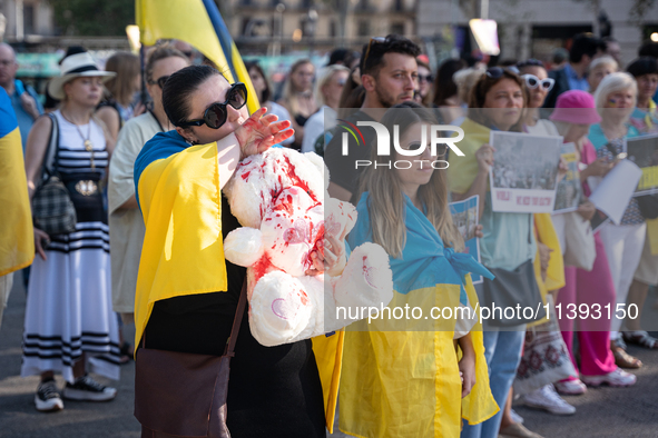 Ukrainian community protest against the Russian shelling of Ohmatdyt Children's Hospital in Kyiv, Ukraine, in Barcelona, Spain, on July 8, 2...