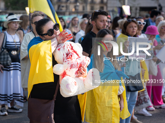 Ukrainian community protest against the Russian shelling of Ohmatdyt Children's Hospital in Kyiv, Ukraine, in Barcelona, Spain, on July 8, 2...