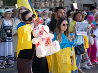 Ukrainian community protest against the Russian shelling of Ohmatdyt Children's Hospital in Kyiv, Ukraine, in Barcelona, Spain, on July 8, 2...