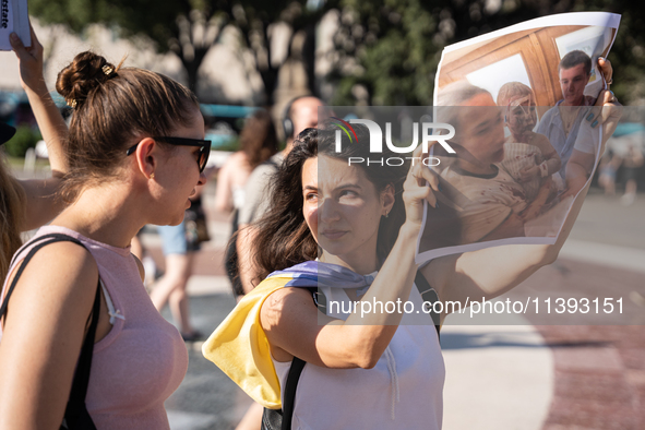 Ukrainian community protest against the Russian shelling of Ohmatdyt Children's Hospital in Kyiv, Ukraine, in Barcelona, Spain, on July 8, 2...