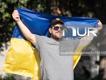 Ukrainian community protest against the Russian shelling of Ohmatdyt Children's Hospital in Kyiv, Ukraine, in Barcelona, Spain, on July 8, 2...