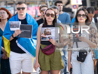 Ukrainian community protest against the Russian shelling of Ohmatdyt Children's Hospital in Kyiv, Ukraine, in Barcelona, Spain, on July 8, 2...