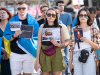 Ukrainian community protest against the Russian shelling of Ohmatdyt Children's Hospital in Kyiv, Ukraine, in Barcelona, Spain, on July 8, 2...