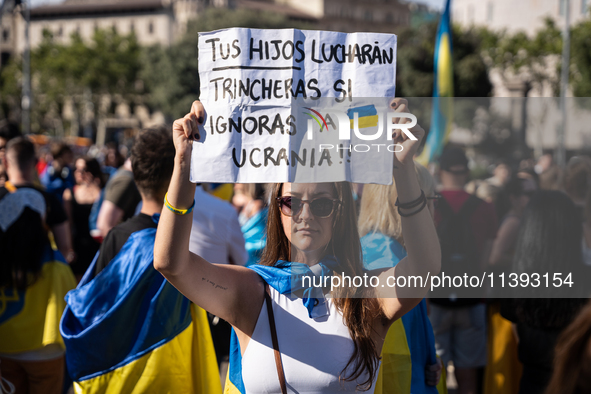 Ukrainian community protest against the Russian shelling of Ohmatdyt Children's Hospital in Kyiv, Ukraine, in Barcelona, Spain, on July 8, 2...