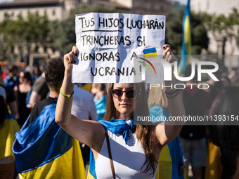 Ukrainian community protest against the Russian shelling of Ohmatdyt Children's Hospital in Kyiv, Ukraine, in Barcelona, Spain, on July 8, 2...