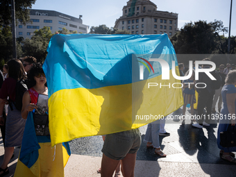 Ukrainian community protest against the Russian shelling of Ohmatdyt Children's Hospital in Kyiv, Ukraine, in Barcelona, Spain, on July 8, 2...