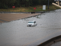 A single car is being seen abandoned on a flooded I10 at Washington St. in Houston, Texas, on July 8, 2024. (