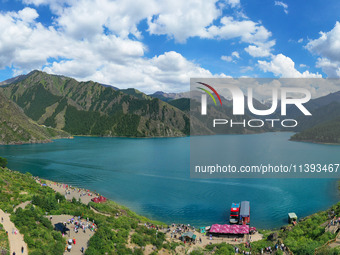 Tourists are visiting the Tianchi Scenic spot in Fukang, China, on July 8, 2024. (