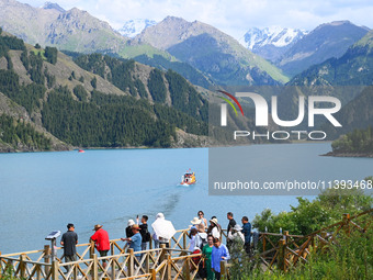 Tourists are visiting the Tianchi Scenic spot in Fukang, China, on July 8, 2024. (